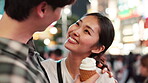 Love, night and bonding of couple, city and fun for tourists, ice cream and anniversary for relationship. Outdoor, tourism and snack for Japanese people, romance and together on holiday and Tokyo