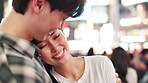 Smile, Japanese and couple with hug in city for travel, romantic vacation and love of culture location. Happy, people and embrace with evening commute, urban sightseeing and bonding together in Japan