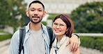 Couple, face and hug in park for love, bonding and communication with romance, embrace or support. Man, woman and happy people in portrait for relationship, travel and tourism with holiday in Japan
