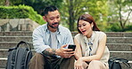 Couple, phone and steps with scroll in city, park and social media for travel and vacation destination. Japanese man, woman and funny meme with adventure, support and nature trip on holiday in Tokyo