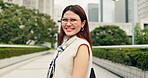 Happy, asian woman and city with tourist for travel, holiday or sightseeing journey in an urban town. Portrait, japanese or female person with smile or glasses for destination or location in Japan
