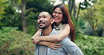 Couple, walking and piggyback in park for love, bonding or communication with romance, care or pointing. Man, woman and conversation outdoor for relationship, travel and tourism with holiday in Japan