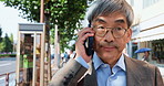 Phone, call and mature businessman in city with glasses, conversation or salaryman on morning commute. Urban, street and Japanese business man waking with smartphone, communication or discussion
