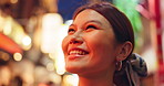 Night, thinking and travel with woman at market, Omoide Yokocho, for sightseeing, tourism or travel. City, smile and street with tourist person in Japan for adventure, holiday or vacation abroad