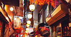 Japan, city and outdoor with street, travel and decorations for tourism, lights and buildings. Empty, celebration or prepare for ceremony, community or symbols for ancient ritual or Shinjuku district