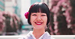Japanese girl, face and kimono in city with fashion, confidence and pride for culture. Woman, happy or portrait in urban Tokyo with traditional attire, heritage or indigenous style with smile in town