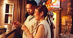 Street, order and couple in city for Asian food, choice or meal together at outdoor restaurant. Japanese people, culture and option for cuisine, snack or catering service on romantic date in Japan