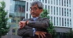 Mature, business man and check watch outdoor for time management, schedule and waiting for public transport. Punctual, japanese person and monitor clock in city street with taxi delay for appointment