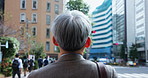 City, professional and back of mature Asian man for morning commute, travel and journey. Business, corporate worker and Japanese person walking in metro town for career, job and work opportunity