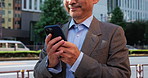 City, typing and business man with phone, online chat and salaryman on morning commute. Urban, street and Japanese businessman with smartphone, communication and mobile app for schedule planning