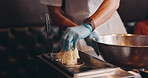 Noodles, cooking and hands of Asian chef for learning culinary skill, hobby and meal prep. Fine dining, dinner and Japanese person with hot pot for ramen, gourmet food and traditional cuisine