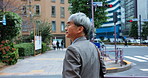 Crossing, business and mature Asian man in city for morning commute, travel and journey. Professional, corporate worker and back of Japanese person in metro town for career, job and work destination