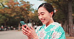 Happy, kimono and Asian woman in city with phone laugh for social media meme, networking and contact. Travel, traditional fashion and Japanese person on smartphone for online joke, website and chat