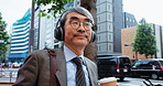 Mature man, headphones and city for business trip, thinking and listening to music with subscription. Professional person, audio and commute to workplace with streaming, walking and road in Japan