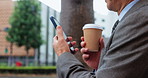 Hands, phone and coffee for business trip in city for person, notification or search for direction in street. Employee, smartphone and cup for espresso, drink or chat with mobile app on road in Japan