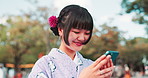 City, kimono and Asian woman with phone laughing for social media meme, networking or communication. Travel, traditional fashion and Japanese person on smartphone for online chat, website or internet