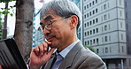 Mature businessman, thinking and tech in city for planning, brainstorming and map app direction in Japan. Asian architect, man and tablet in Tokyo for problem solving with ideas for urban development