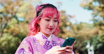 Typing, kimono and Asian woman in city with phone for social media, networking and communication. Travel, traditional fashion and Japanese person on smartphone for online chat, website and internet