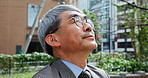 Breathing, business and peace with Japanese man in city for balance, stress relief and calm mindset. Mental health, wellness and corporate with mature person in outdoors for professional and thinking
