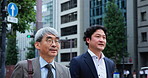 Walking, morning and team with business people in Japan city for mentor, conversation and client negotiation. Partnership, corporate and travel with men in outdoors for discussion and collaboration