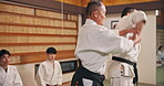 Master, student and practice in dojo for karate, kung fu and training with fitness, fight and class. Martial arts, discipline and workout for exercise, teaching and self defense with sensei in Japan