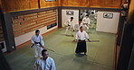 People, students and stick for martial arts, training and aikido with fitness, kung fu and battle in Japan. Teaching, bokken and sensei for karate, fight and self defense class with exercise in dojo