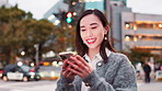 Laugh, typing and woman in city with phone, connection and funny online chat on morning commute. Smartphone, search and Japanese girl in street on mobile app for social media, smile and urban travel