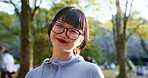 Japan, face and woman with fitness, smile and glasses with adventure, journey and wellness. Asian person, runner or athlete in park, sightseeing or travel with breathing or break with morning routine
