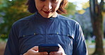 Japanese, man and student with phone outdoor for chat, scholarship update and university application. Person, mobile and communication with education feedback, study news and travel location in Japan