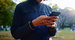 Hands, student and typing with phone outdoor for chat, scholarship update and university application. Person, mobile and communication with education feedback, study news and travel location in Japan