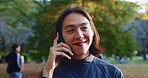 Japanese, man and smile with phone call outdoor for talking, scholarship update and commute to university. Male student, mobile and discussion with education feedback, study news and travel in Japan