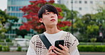 Man, student and smartphone for travel in city with thinking, direction and search for landmark with commute. Person, smartphone and outdoor with mobile app, map and check notification in Japan