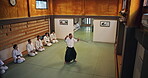 Sensei, students and stick for martial arts, aikido and training with fitness, people and battle in Japan. Teaching, bokken and master for karate, fight and self defense class with exercise in dojo