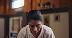 Face, woman student or bow in dojo for karate practice, martial arts and self defense in class. Respect, honor or girl fighter in Japan for learning combat or training workout for fighting education