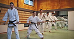 Sensei, student and learning for fight, martial arts and aikido with fitness, kung fu and stick in Japan. Training, bokken and master for karate, battle and self defense class with exercise in dojo