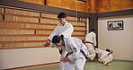 People, students and training in dojo for karate, kung fu and practice with fitness, fight and learning. Martial arts, discipline and workout for exercise, class and self defense with combat in Japan