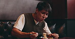 Happy, man and eating ramen in restaurant for nutrition, lunch and dinner meal with noodles and laughing. Customer, food and enjoyment with chopsticks for healthy dish or traditional Japanese cuisine