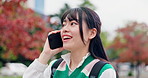 Travel, smile and Asian woman in city with phone call, conversation and connection on campus. Urban, park and Japanese university student with smartphone, happy face and discussion on morning commute