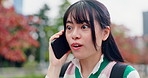 Travel, smile and happy woman in city with phone call, conversation and connection on campus. Urban, gossip and Japanese university student with smartphone, surprise and discussion on morning commute