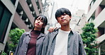 Japanese couple, face and street in city, low angle and together for travel, trip or love in road. Man, woman and gen z students for connection, bonding and portrait with streetwear on urban sidewalk