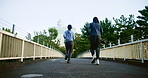 Back, fitness and couple in city for running, wellness and cardio exercise in Japan. Asian people, training and racing on Tokyo bridge for commitment, healthy relationship and support for growth