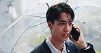 Talking, phone call and man in city with umbrella, business discussion and morning commute in winter. Rain, cover and Japanese businessman with smartphone, communication or urban travel on street