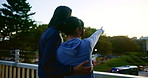 Japanese couple, hug and outdoor at sunset, pointing and back view together with partner for travel. Man, woman and embrace in city for sightseeing, support and romantic connection for love on date