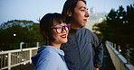 Japanese couple, smile and date outdoor, bonding and together with happy partner on vacation at night. Asian man, woman and relationship on city bridge for travel, support and connection for love