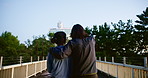 Couple, walking and back with bridge for travel, sightseeing or adventure together in japan. Man, woman or lovers enjoying tour, stroll or natural view of scenery on outdoor path or passage in nature