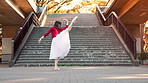 Woman, ballerina and dancing with performance in city by stairs with moving, balance and rhythm in street. Person, dancer and tutu for art with elegance, concert and spin on urban sidewalk in Japan