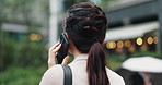 Talking, walking and woman in city with phone call, discussion and morning commute from back. Contact, chat and Japanese businesswoman with smartphone, communication and urban travel in business park