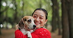 Hug, face or Asian woman with dog at park for care or love with companion or bonding together. Japanese, portrait or pet beagle puppy in nature with smile, loyalty or animal for trust or joy in Japan