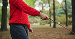 Leash, walking and person with animal at park for exercise and love with companion and bonding together. Hands, healthy or pet in outdoor nature with rope, loyalty and dog for trust or peace in Japan