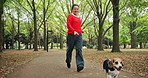 Running, travel and Asian woman with dog in park with pet leash for fresh air, adventure and training. Happy, animal care and Japanese person with Beagle in nature for wellness, health and exercise